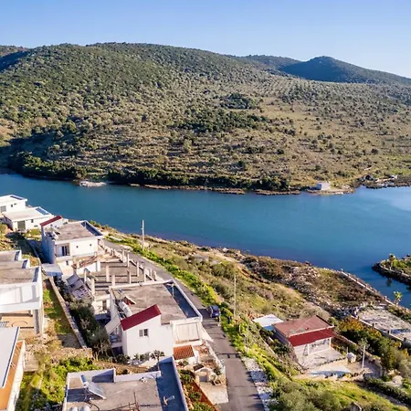 Agim Doko Εξαμίλιο